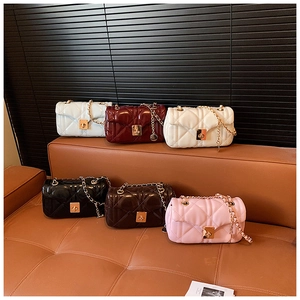 Collection of quilted crossbody bags in six colors with gold chain straps and metal locks