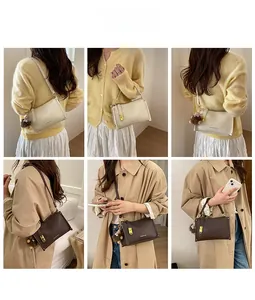 Detail view of the stylish small square handbag shown in shoulder and crossbody styles
