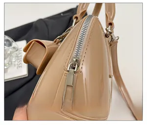 Close-up of the smooth metal zipper and glossy texture on this stylish jelly bag
