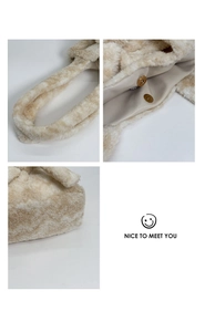 Detail view of plush tote bag featuring magnetic closure and soft textured handle