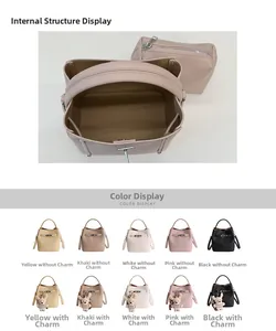 Detail view of lychee leather bucket bag with inner pouch and teddy bear charm