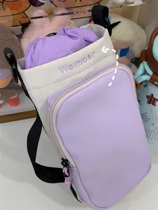Detailed shot of purple mini crossbody bag with Welldoer embroidery and drawstring closure