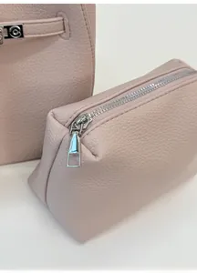 Detail of light pink lychee pattern bucket bag with matching inner zipper pouch