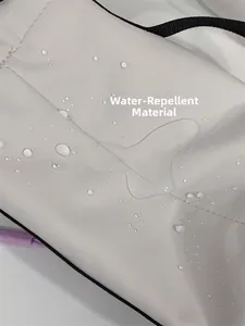 Detailed close-up showing water-repellent nylon fabric with spherical water droplets