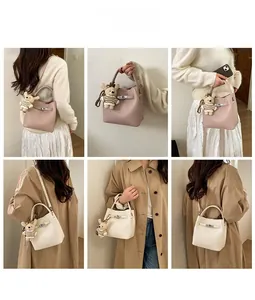 Detailed views of crossbody bucket bag with litchi texture and cute bear charm
