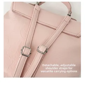 Pink backpack detail showing detachable adjustable straps with silver metal buckles