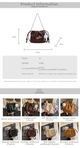 Detailed view of ruched bucket bag showing PU leather texture and metal chain strap