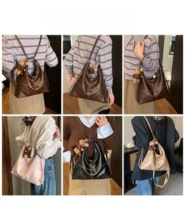 Close-up of vintage faux leather tote bags in four colors with quilted stitching details