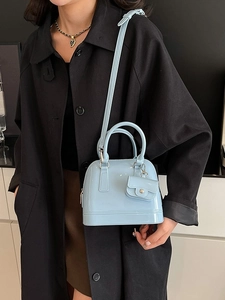 Light blue jelly shoulder bag in shell shape with mini flap purse and long strap