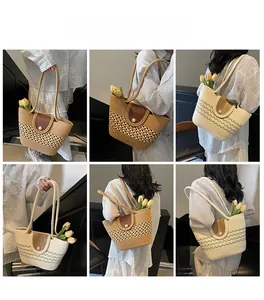 Detail view of woven straw tote bag with pearl magnetic flap and thin leather straps