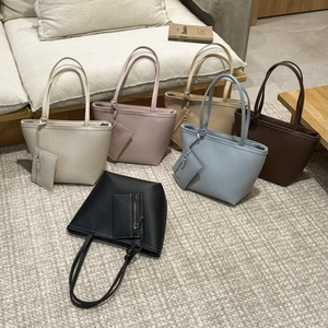 Minimalist leather tote bag set in six colors with long handles and matching coin pouches