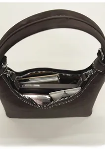 Spacious interior of dark brown pebbled leather hobo bag with contrast stitching