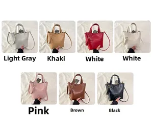 Detail view of stylish textured PU leather tote bag in seven chic color options