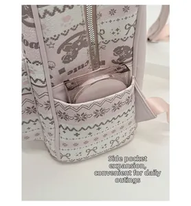 Detail of the expandable side pocket on a pink leather backpack with cute motifs