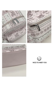 Detail view of pink PU leather backpack texture and premium silver metal zipper