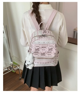 Pink PU leather backpack with rocking horse print and a cute white bunny pendant
