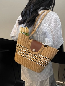 Khaki woven straw tote bag with pearl leather flap and color-stripe accents