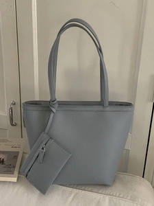Minimalist fog blue textured leather tote bag with a matching small pouch for daily commute
