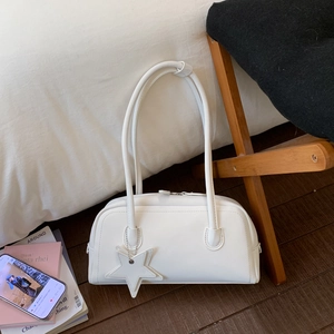 White minimalist PU leather bowling handbag with long straps and star pendant detail