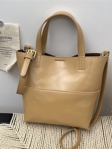 Minimalist beige PU leather tote bag with dual handles and adjustable shoulder strap