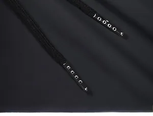 Detail view of high-quality black ice silk drawstring with silver metal tips