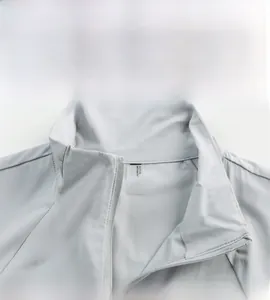 Detail view of the stand collar and size tag on a light gray sun protection jacket