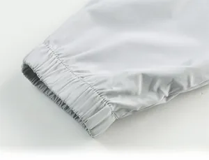 Close-up of light grey UV protection jacket showing elastic cuffs and smooth fabric texture