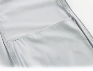 Macro detail of fine stitching and zipper on light grey breathable sun protection jacket