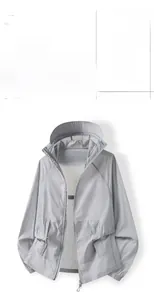 Detailed view of light gray quick-dry sun protection jacket with hood and pockets