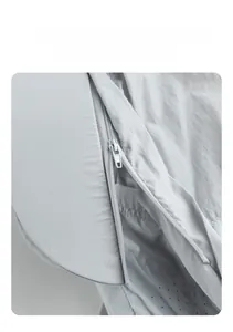 Vue détaillée d'une veste de protection solaire gris clair avec bord amovible zippé