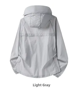 Detail of light gray sun protection jacket showing the hood and breathable back vent