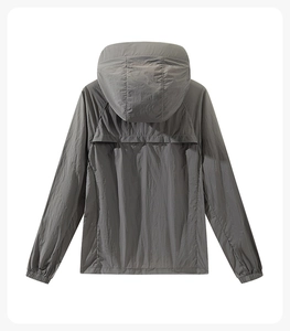 Rear view of dark grey outdoor jacket with breathable back vent and hood