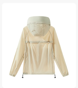 Close-up of lightweight light beige sun protection jacket back with breathable vent and hood