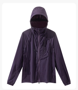 Macro detail of dark purple sun protection jacket with hood and functional zip pocket