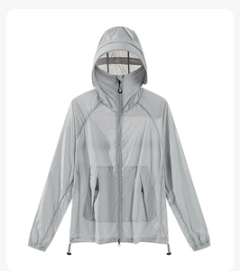 Flat lay of a light grey thin hooded sun protection jacket with zipper pockets and drawstrings