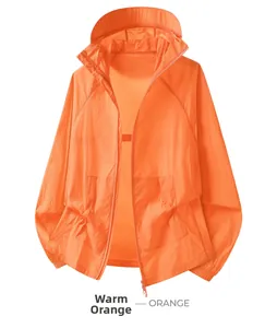 Detail of thin orange sun protection jacket with adjustable hood and drawstring waist