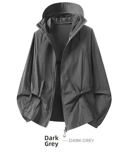 Detail of dark grey sun protection jacket with elastic cuffs and lightweight fabric