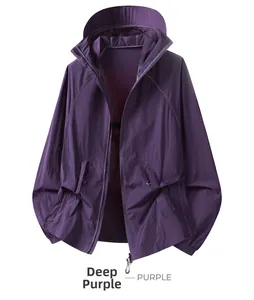 Detail view of deep purple sun protection hoodie with zipper pockets and drawstring