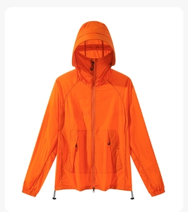 Detail of a bright orange lightweight hooded sun protection jacket with a high collar zip