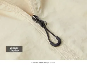 Détail de la fermeture éclair et du tissu en nylon léger de la veste de protection solaire