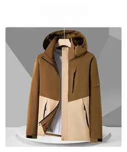 Detail of outdoor hooded jacket showing waterproof zippers and contrast paneling design