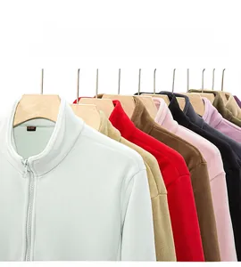 Detail showing various colors of detachable fleece jacket liners on wooden hangers