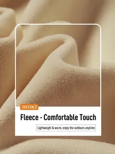 Close-up of warm beige thick Orlik fleece fabric for 3-in-1 waterproof outdoor jackets