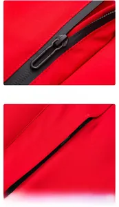 Detail of durable black zipper and invisible pocket on red waterproof outdoor jacket