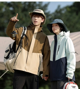 Outdoor 3-in-1 waterproof jacket set for couples shown in a mountain camping scene