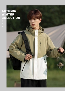 Detail of khaki and white color block waterproof outdoor jacket with hood and pockets