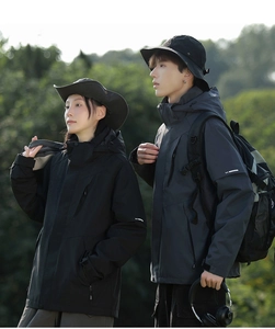 Close-up of waterproof 3-in-1 jackets with adjustable hoods and tactical outdoor details