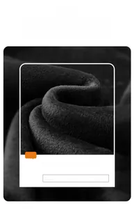 Close-up of thick black polar fleece fabric showing premium warm and soft texture