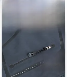 Detail view of a waterproof zipper with Outdoor lettering on a functional hiking jacket