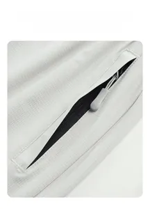 Close-up of light grey ice silk fabric with breathable texture and zipper pocket detail